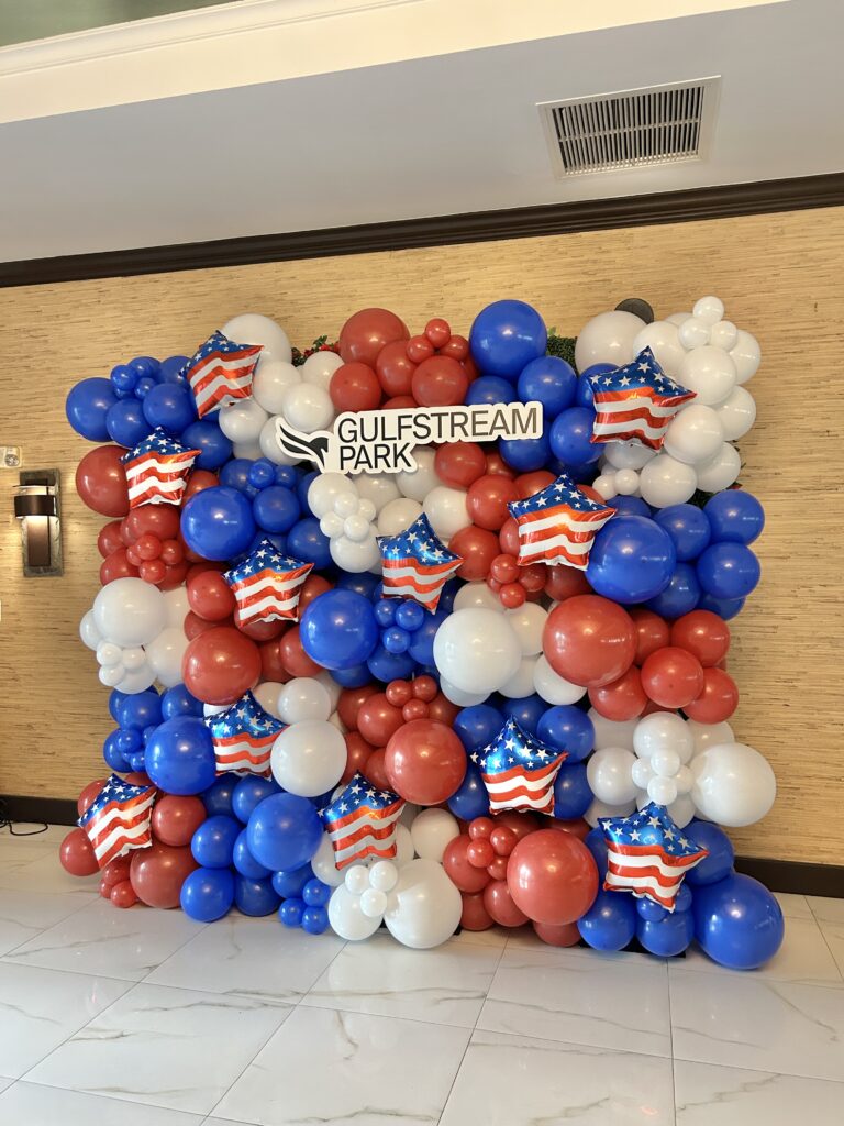 Red, white and blue balloon wall installation