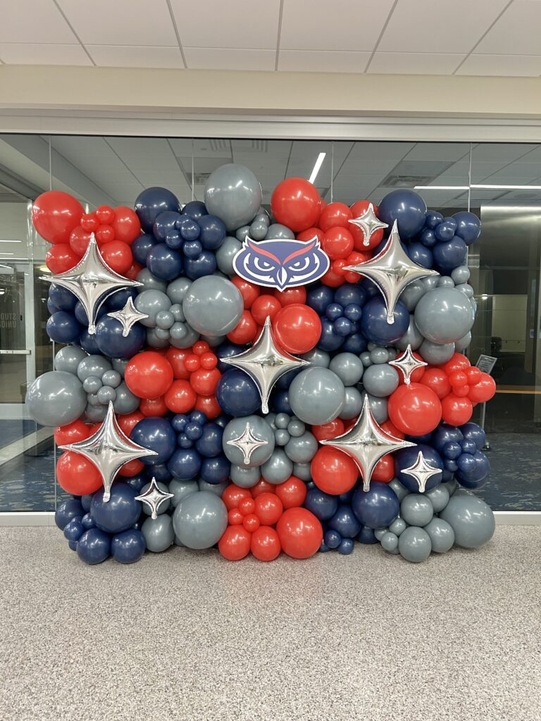 Red, navy and silver balloon wall with star balloons