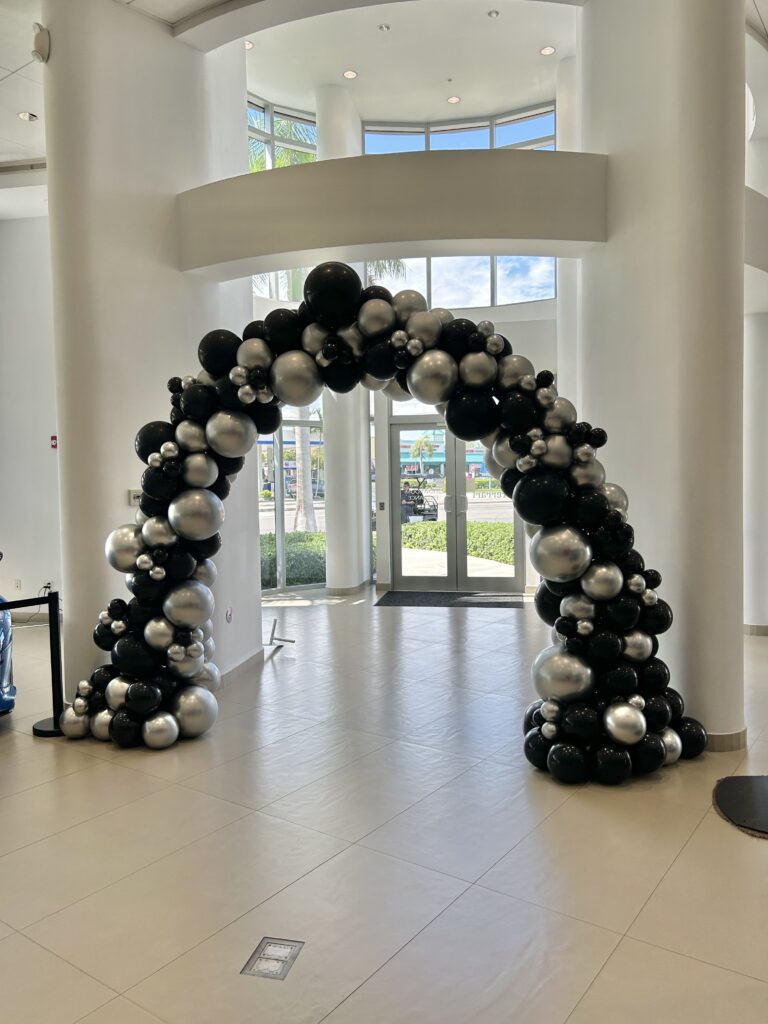 Black and silver balloon arch